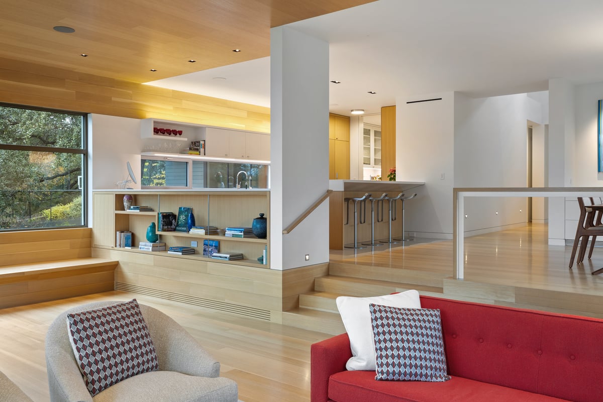 Built-in shelves and oak steps at the edge of the great room
