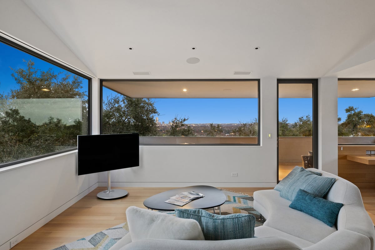Upstairs lounge looking toward the terrace door and the skyline beyond