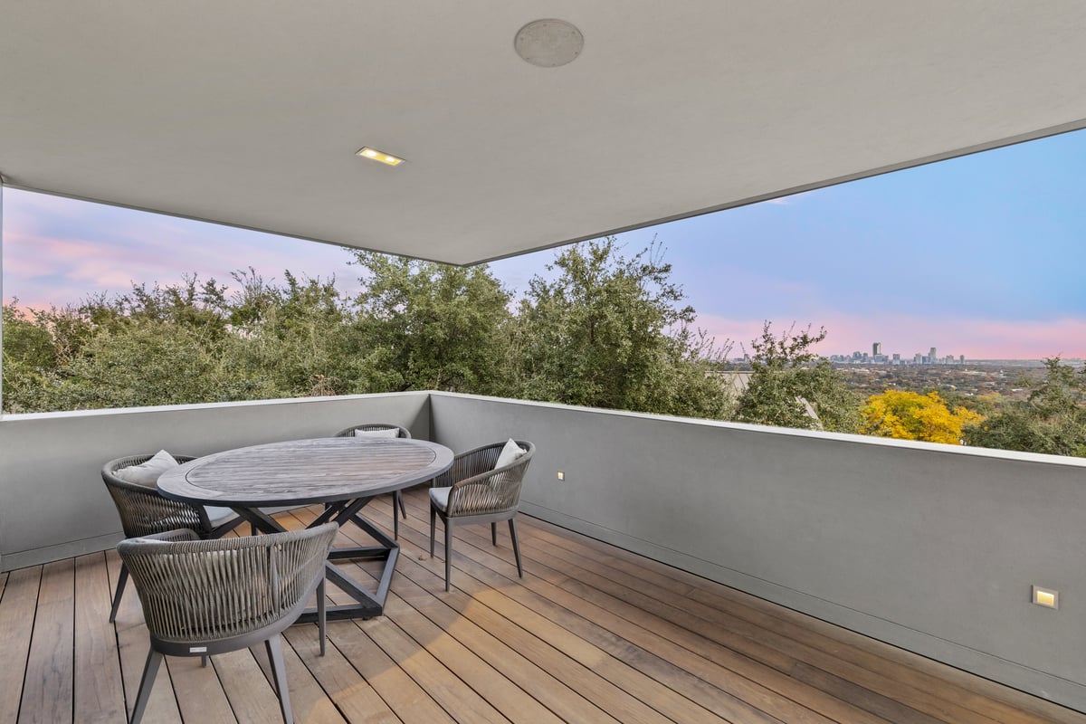 Upper terrace table set against the hills and the downtown skyline