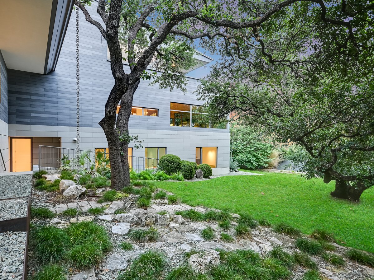 Rock garden and lawn under an oak beside the lower level