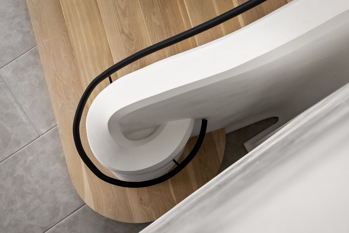 Curved staircase detail at The Lantern, custom craftsmanship