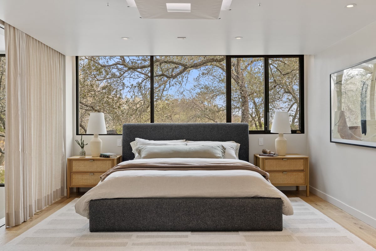 The primary bedroom facing the trees