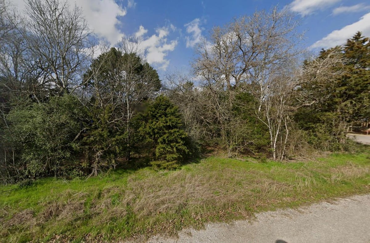 View 0 Road Runner Lane in Lake Bastrop Acres 0 Road Runner Lane - front exterior - Luxury lot in Lake Bastrop Acres, Bastrop, TX