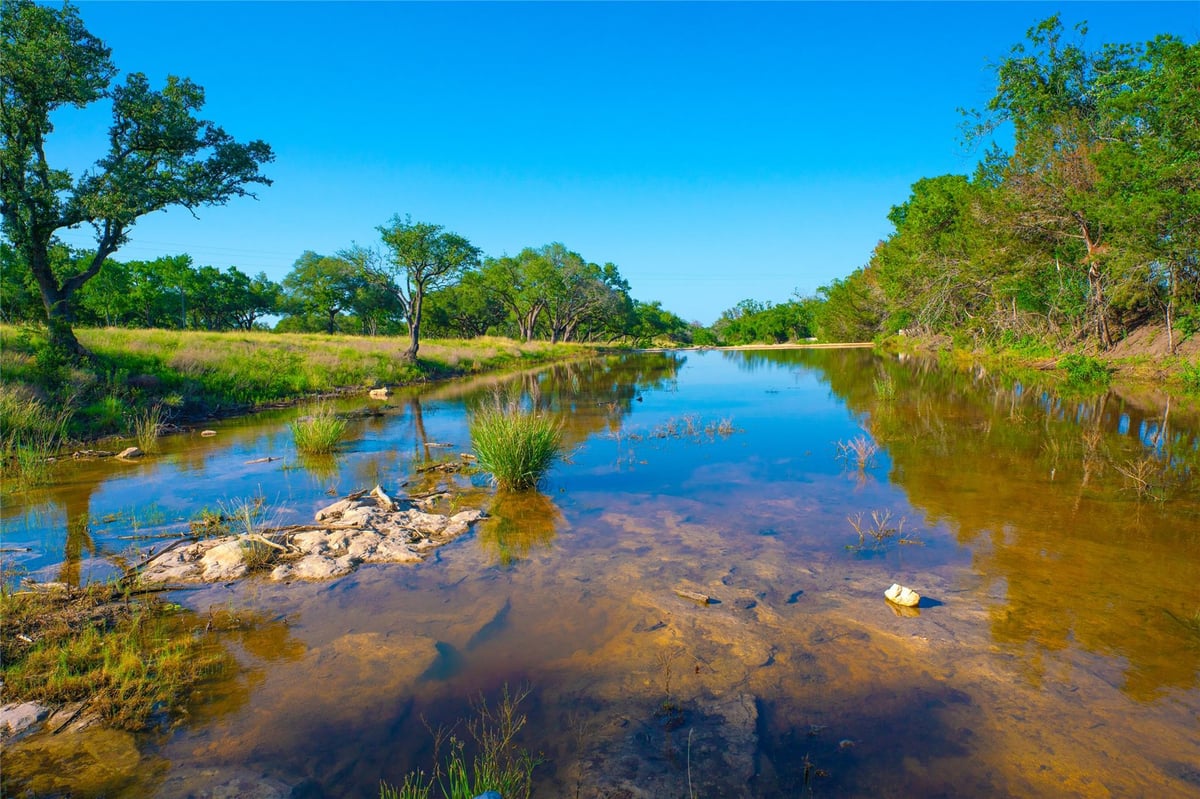 View 0 Rocky Creek RNCH in Flat Creek Ranches 0 Rocky Creek RNCH - property photo 1 - Luxury lot in Flat Creek Ranches, Johnson City, TX
