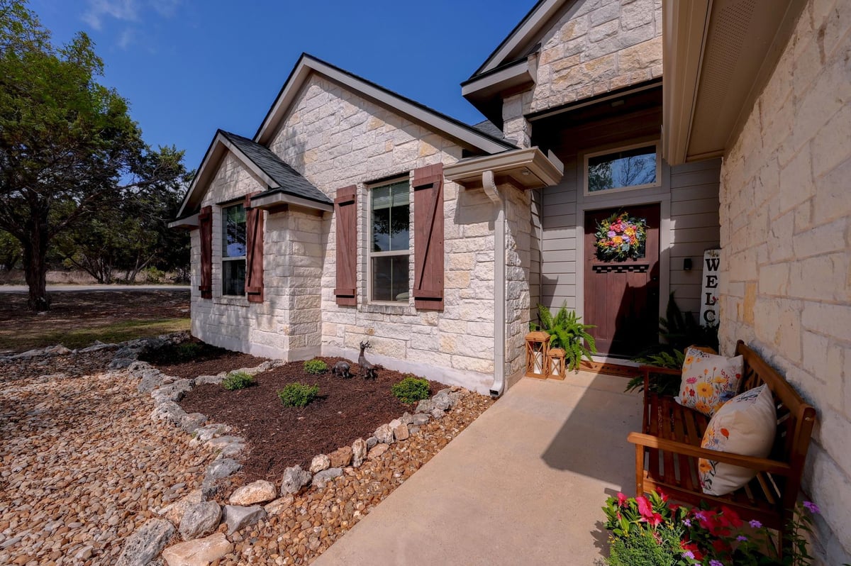 View 1 Sunset Cir in Woodcreek Sec 11 1 Sunset Cir - property photo 1 - Luxury home in Woodcreek Sec 11, Wimberley, TX