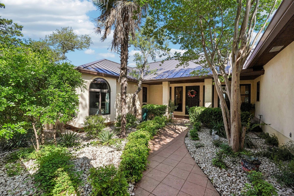 View 100 Mesa Dr in Spoke Hill Sec 2 100 Mesa Dr - front exterior - Luxury home in Spoke Hill Sec 2, Wimberley, TX