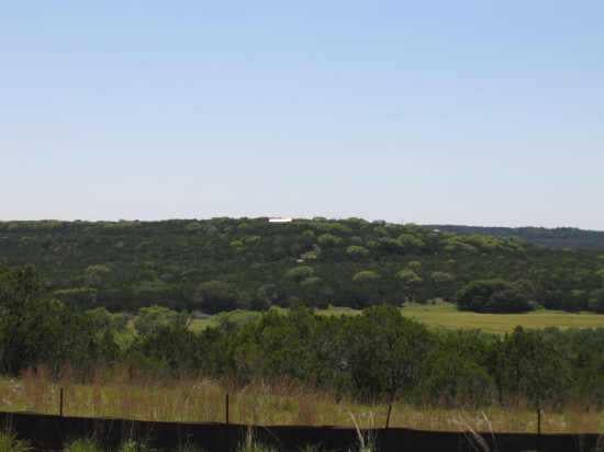 View 10010 Grand Summit BLVD 10010 Grand Summit BLVD - front exterior - Luxury home in Dripping Springs, TX