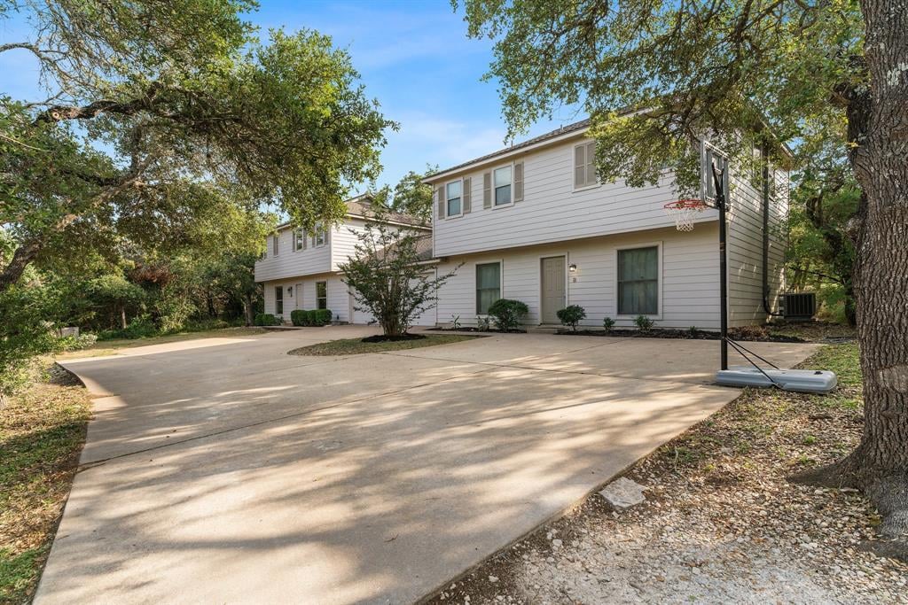 View 10021 Weir Loop Cir in Geneva Estates West Sec Ii 10021 Weir Loop Cir - front exterior - Luxury home in Geneva Estates West Sec Ii, Austin, TX