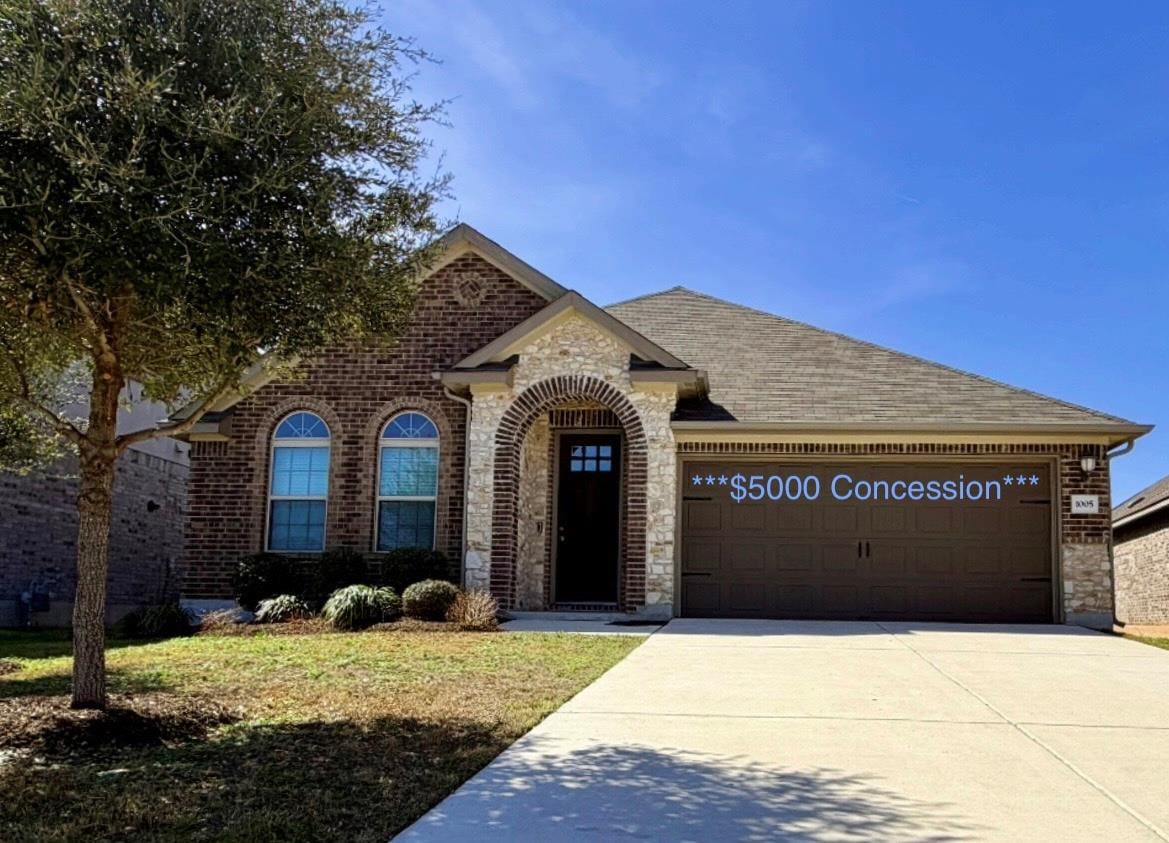 View 1005 Sundrops St in Oak Creek Ph 4 1005 Sundrops St - front exterior - Luxury home in Oak Creek Ph 4, Leander, TX
