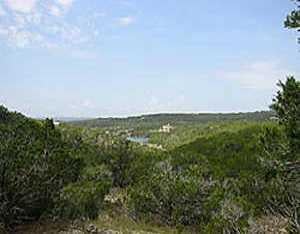 View 1006 Moonlight Bay Dr 1006 Moonlight Bay Dr - front exterior - Luxury lot in Spicewood, TX