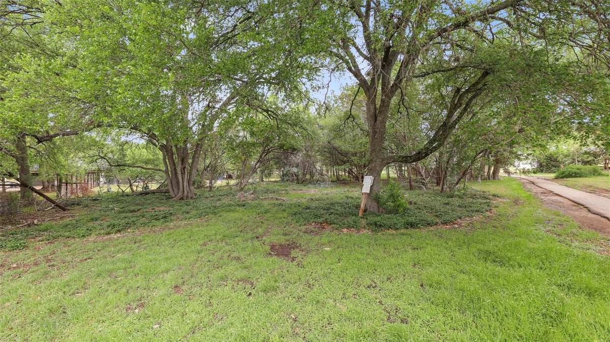 View 101 Brookhollow Dr in Woodcreek Sec 6-C 101 Brookhollow Dr - property photo 1 - Luxury lot in Woodcreek Sec 6-C, Wimberley, TX