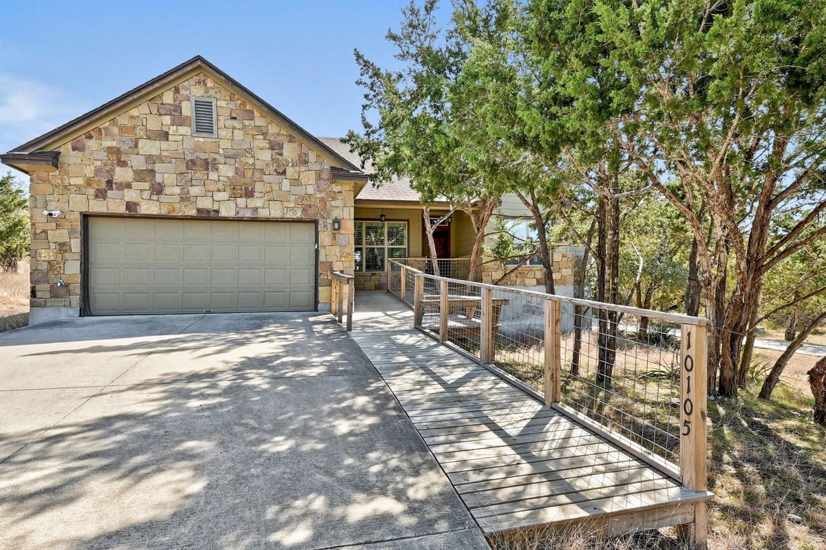 View 10105 Little Creek Cir in Valley Lake Hills Sec 01 10105 Little Creek Cir - front exterior - Luxury home in Valley Lake Hills Sec 01, Dripping Springs, TX