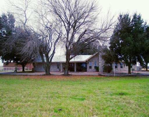 View 1011 FM Rd 619 1011 FM Rd 619 - front exterior - Luxury home in Taylor, TX