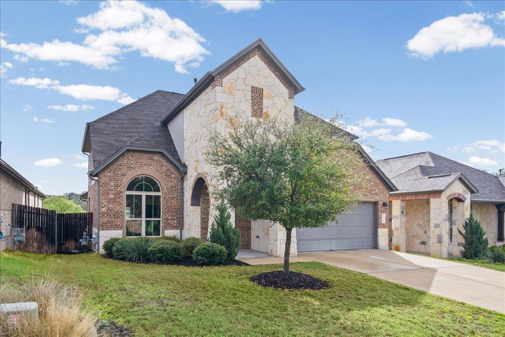 View 1012 Goldilocks Ln in Hills of Bear Creek 1012 Goldilocks Ln - front exterior - Luxury home in Hills of Bear Creek, Manchaca, TX