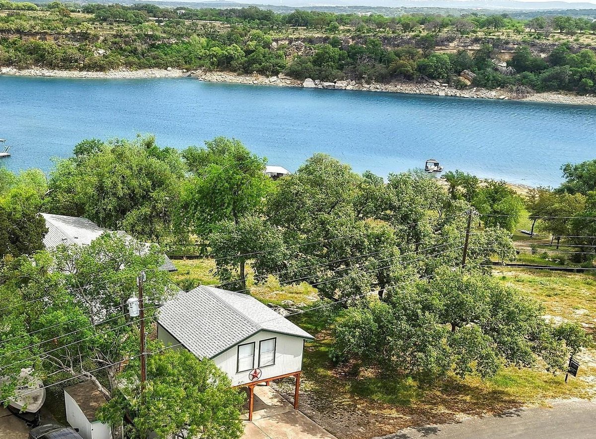 View 1019 Lake Shore Dr in Laguna Vista 1019 Lake Shore Dr - front exterior - Luxury home in Laguna Vista, Spicewood, TX