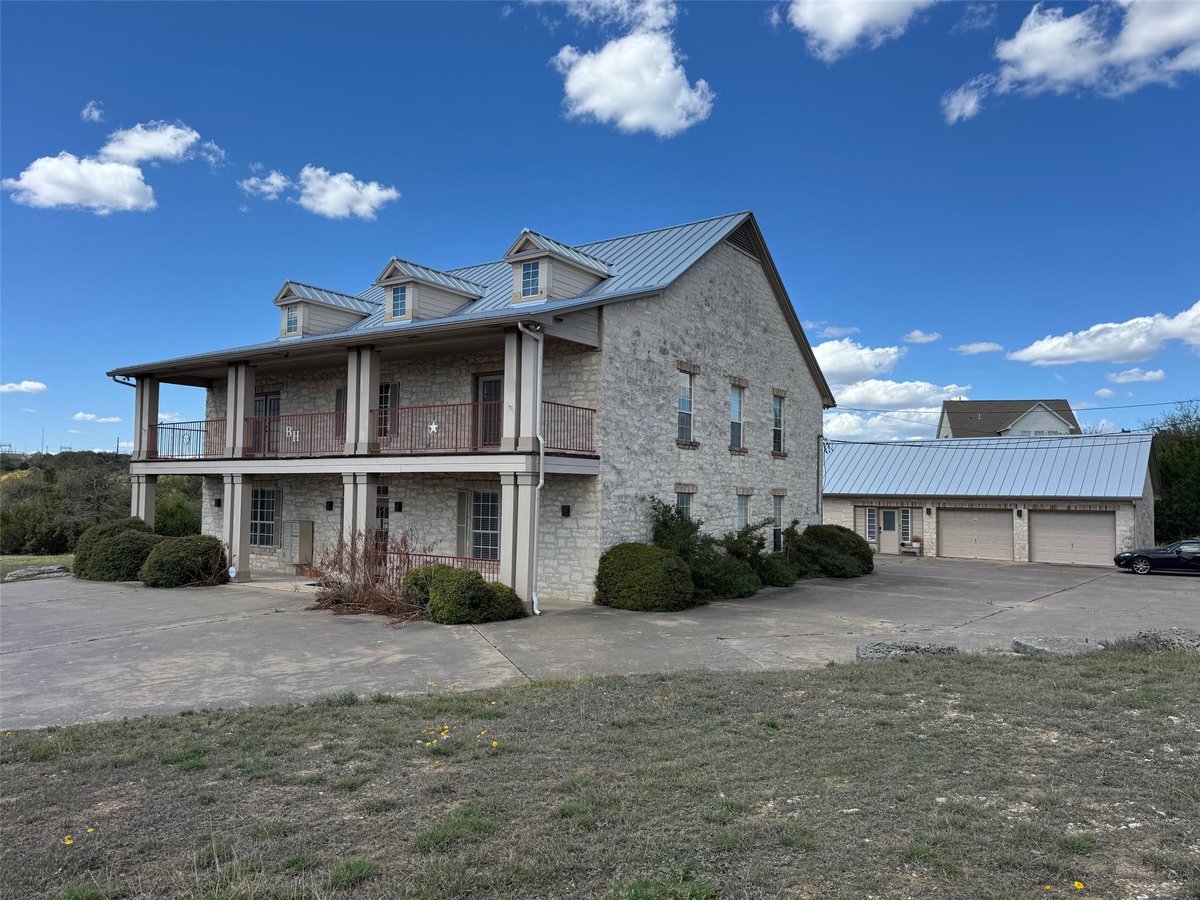 10200 Highway 290 Hwy W - front exterior - Luxury home in Scenic Brook Estates Sec 2 Re-, Austin, TX