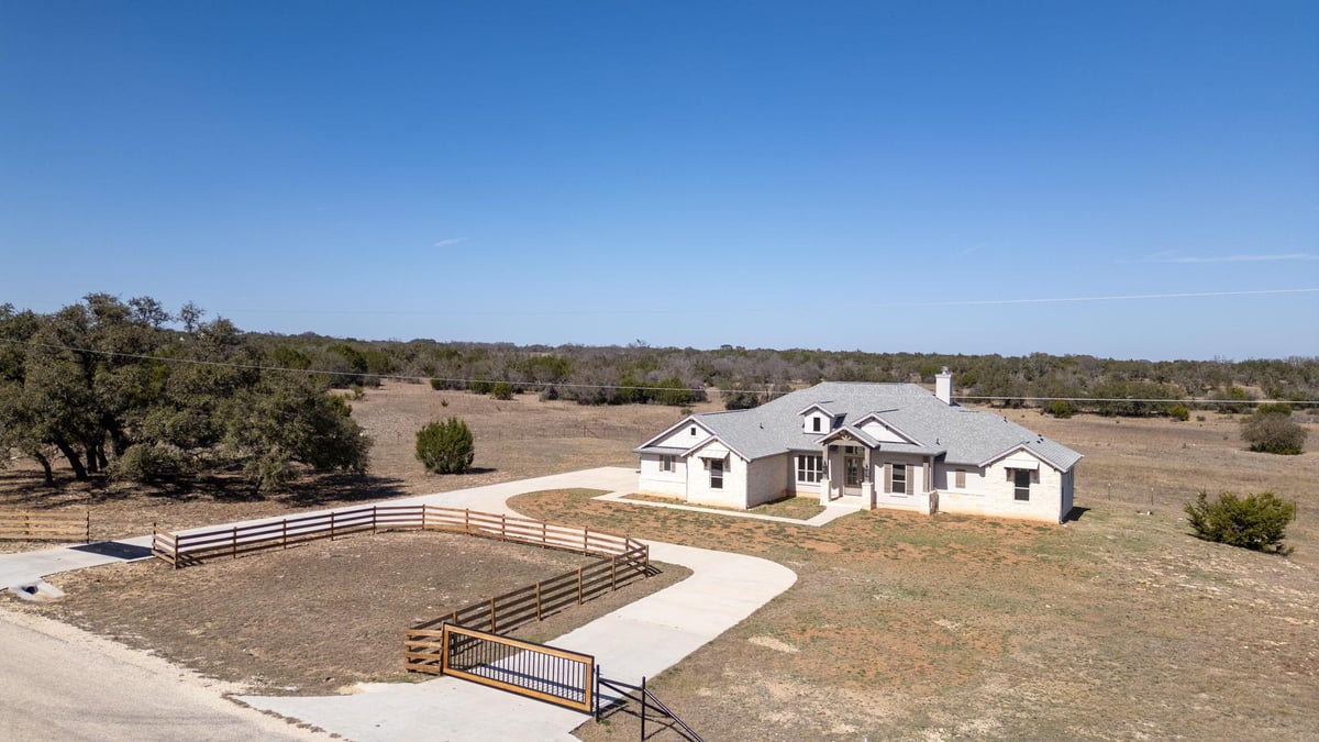 View 103 Buck Rabbit RD in Miller Creek 103 Buck Rabbit RD - front exterior - Luxury home in Miller Creek, Briggs, TX