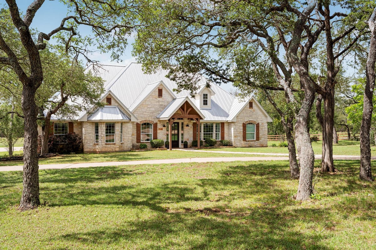 View 103 Horseshoe Dr in Saddletree Ranch Sec 1 103 Horseshoe Dr - front exterior - Luxury home in Saddletree Ranch Sec 1, Dripping Springs, TX
