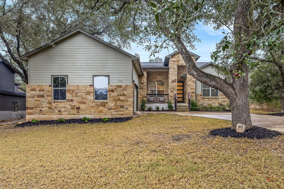 View 103 Kendall Dr in Windermere Oaks 103 Kendall Dr - front exterior - Luxury home in Windermere Oaks, Spicewood, TX