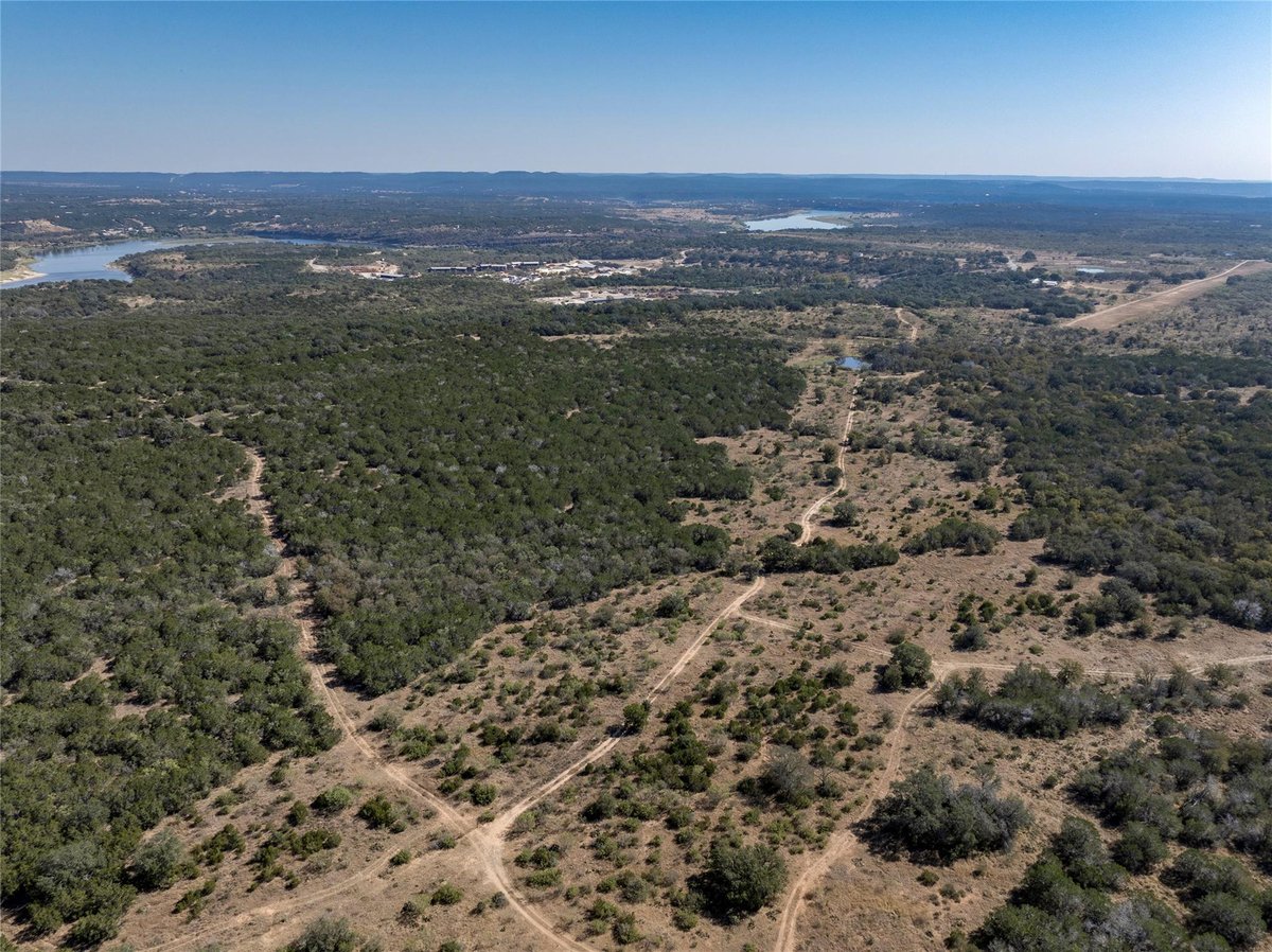 View 1033 Flying X Rd 1033 Flying X Rd - front exterior - Luxury home in Spicewood, TX