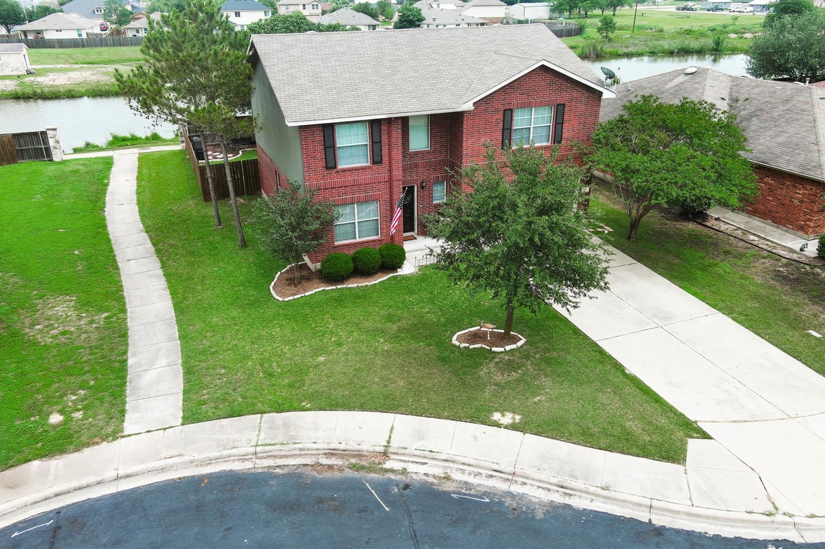 View 104 Trapper Trl in Hunters Crossing 104 Trapper Trl - front exterior - Luxury home in Hunters Crossing, Bastrop, TX