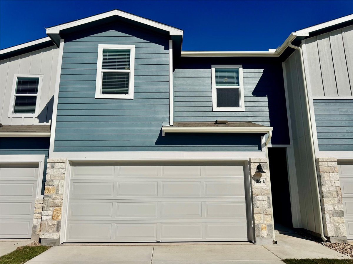 View 105 Calcite Rd Unit #4 in Waterstone Village 105 Calcite Rd Unit #4 - front exterior - Luxury home in Waterstone Village, Kyle, TX