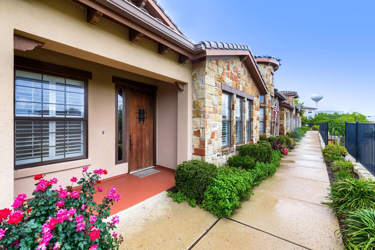 View 105 Lucia Cir Unit #1 in Townhomes At Tuscan Village 105 Lucia Cir Unit #1 - front exterior - Luxury home in Townhomes At Tuscan Village, Lakeway, TX