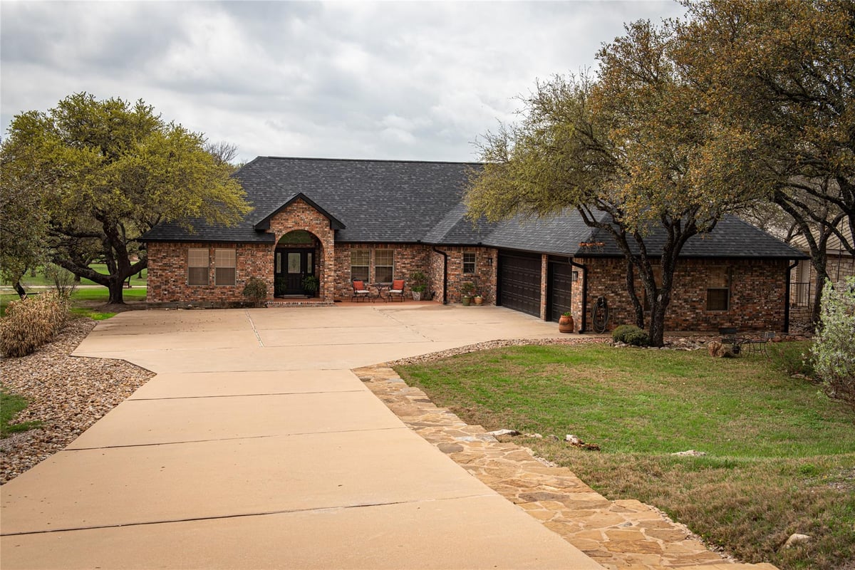 View 105 Wallace Riddell Dr in Delaware Spgs 105 Wallace Riddell Dr - front exterior - Luxury home in Delaware Spgs, Burnet, TX