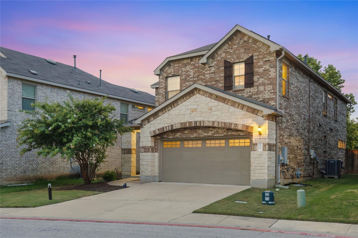 View 1050 Kenney Fort XING Unit #13 in Grove/Kenney Fort Condos 1050 Kenney Fort XING Unit #13 - front exterior - Luxury home in Grove/Kenney Fort Condos, Round Rock, TX