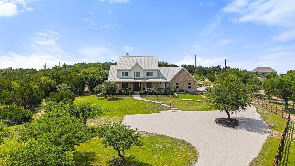 View 1051 Trailhead CIR in Settlers Point Ph 1 1051 Trailhead CIR - front exterior - Luxury home in Settlers Point Ph 1, Dripping Springs, TX