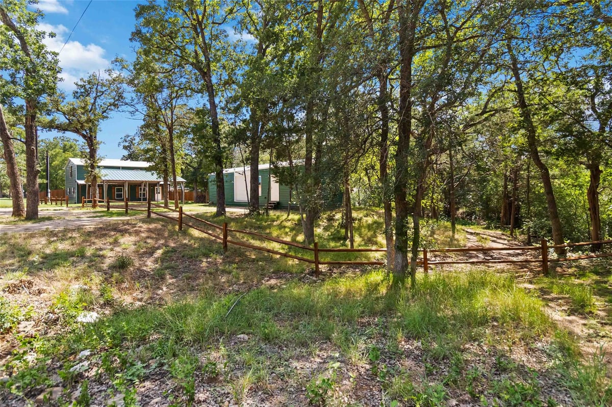 View 106 Harper DR in Lake Bastrop Acres 106 Harper DR - property photo 1 - Luxury home in Lake Bastrop Acres, Bastrop, TX