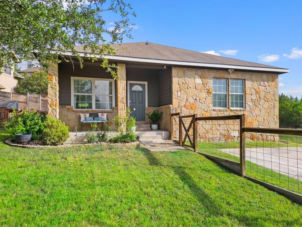 View 10604 Lake Beach DR in Mountain Creek Lakes Sec 01 10604 Lake Beach DR - front exterior - Luxury home in Mountain Creek Lakes Sec 01, Dripping Springs, TX