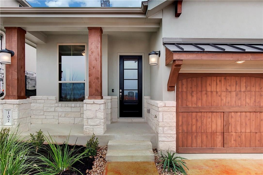 107 Cartwheel Bnd Unit #49 - front exterior - Luxury home in Rough Hollow, Austin, TX