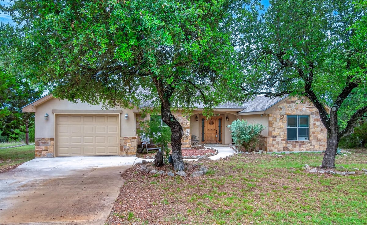 View 107 Garrett Way in Rocky Creek Ranch 11 107 Garrett Way - front exterior - Luxury home in Rocky Creek Ranch 11, Canyon Lake, TX