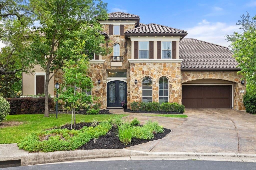 View 108 Aruba Ct in Rough Hollow Sec 10 Resub Of L 108 Aruba Ct - front exterior - Luxury home in Rough Hollow Sec 10 Resub Of L, Austin, TX