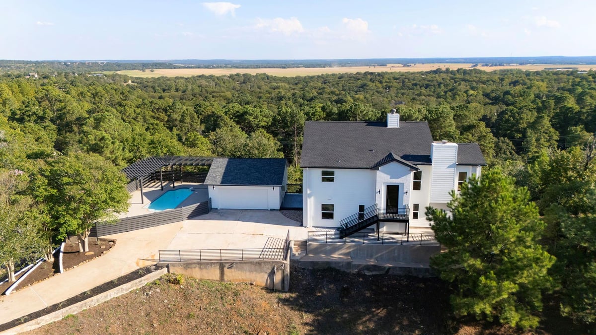View 108 Koolua DR in Tahitian Village Unit 2 108 Koolua DR - front exterior - Luxury home in Tahitian Village Unit 2, Bastrop, TX