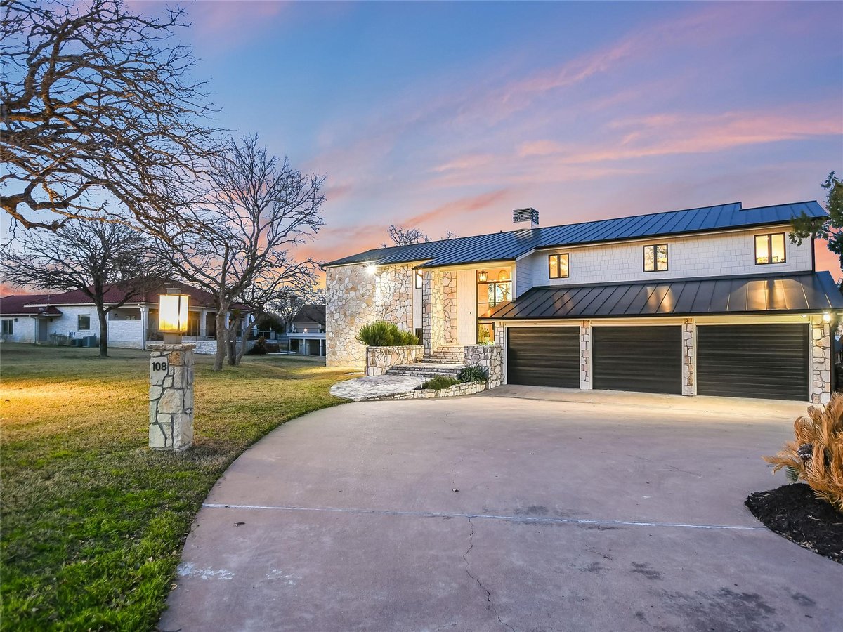 View 108 Third Sid in Horseshoe Bay Proper 108 Third Sid - front exterior with 108 Third Sid in Horseshoe Bay - Luxury home in Horseshoe Bay Proper, Horseshoe Bay, TX