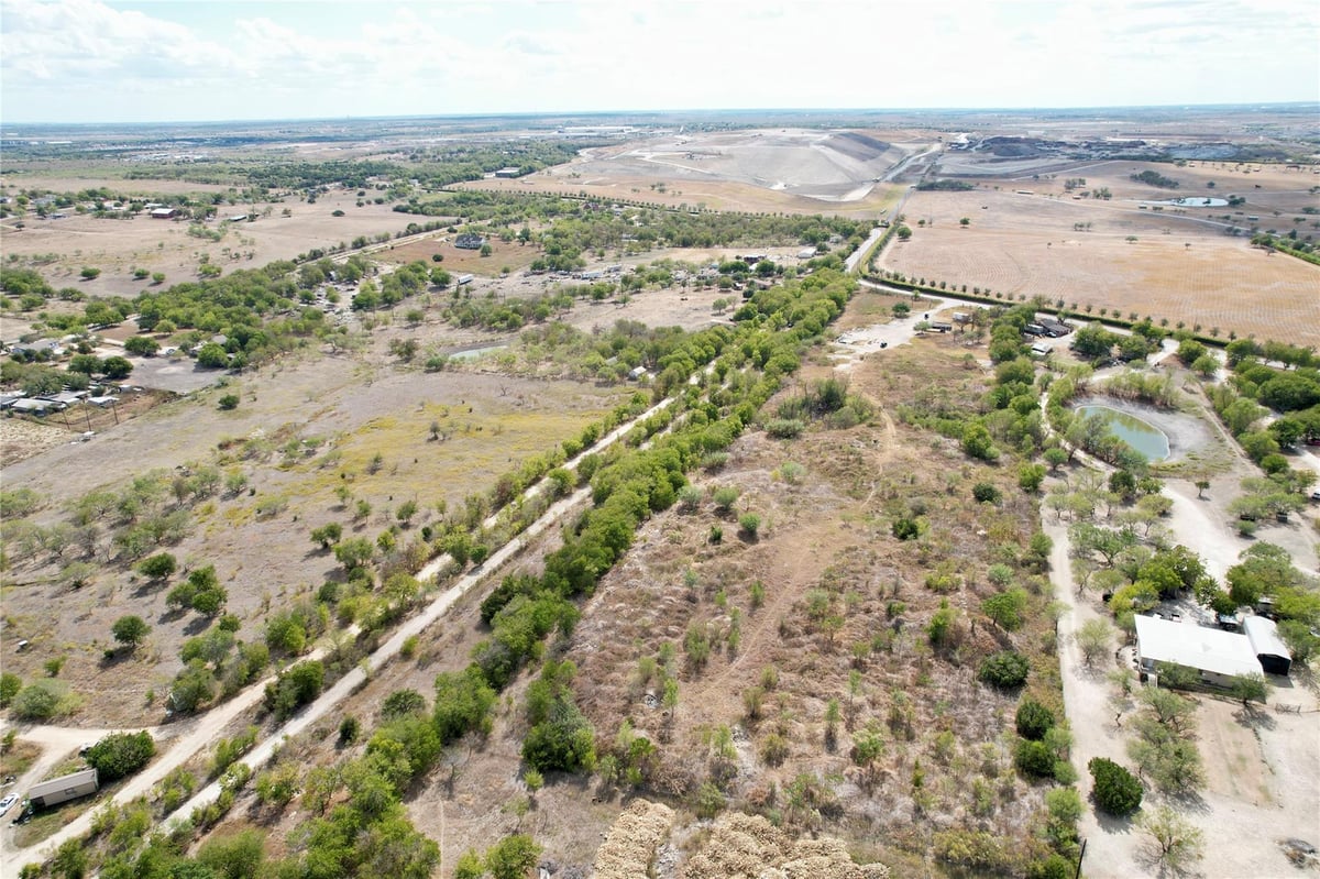 View 10823 Old Lockhart RD in Santiago Del Valle Ten League 10823 Old Lockhart RD - property photo 1 - Luxury home in Santiago Del Valle Ten League, Austin, TX
