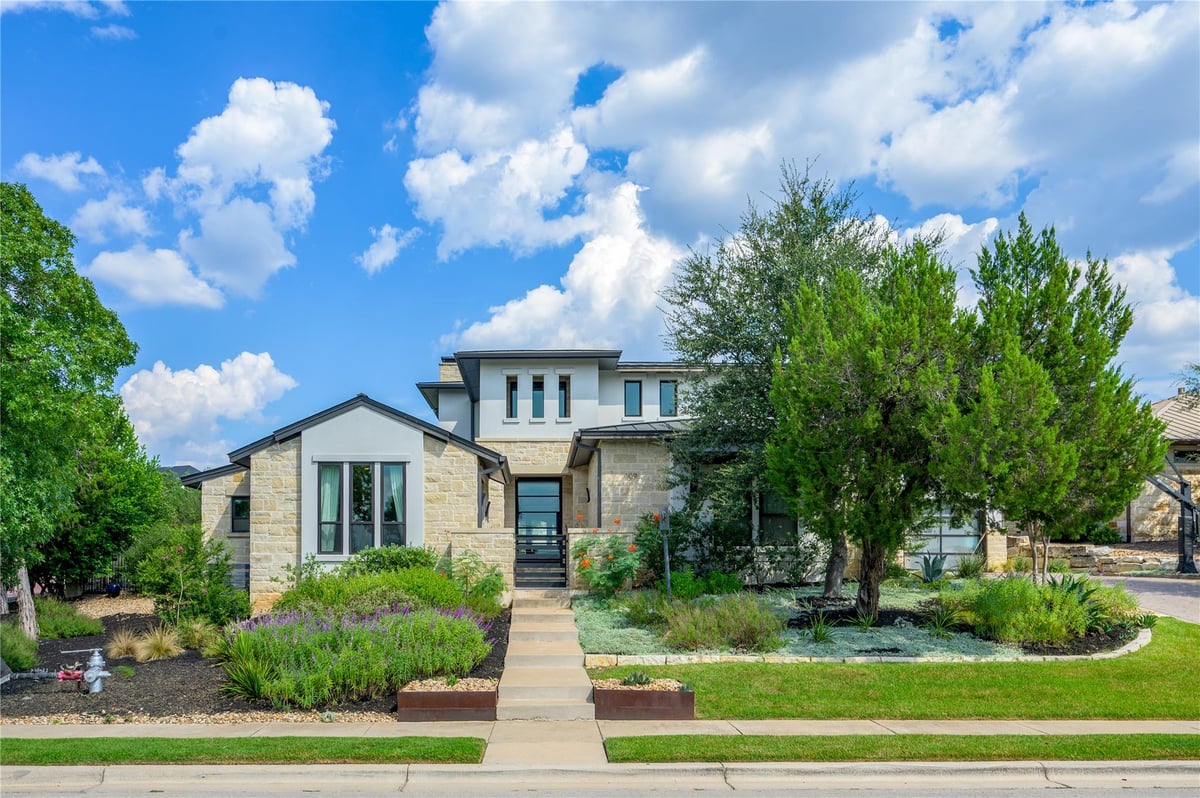 View 109 Bella Colinas Dr in Lakeway Highlands Rough Hollow 109 Bella Colinas Dr - front exterior - Luxury home in Lakeway Highlands Rough Hollow, Austin, TX