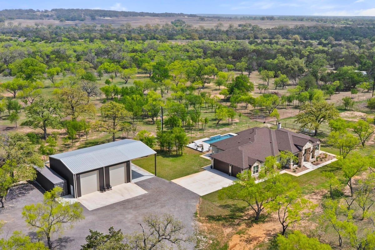 View 10900 Ranch Road 1323 10900 Ranch Road 1323 - front exterior - Luxury home in Johnson City, TX