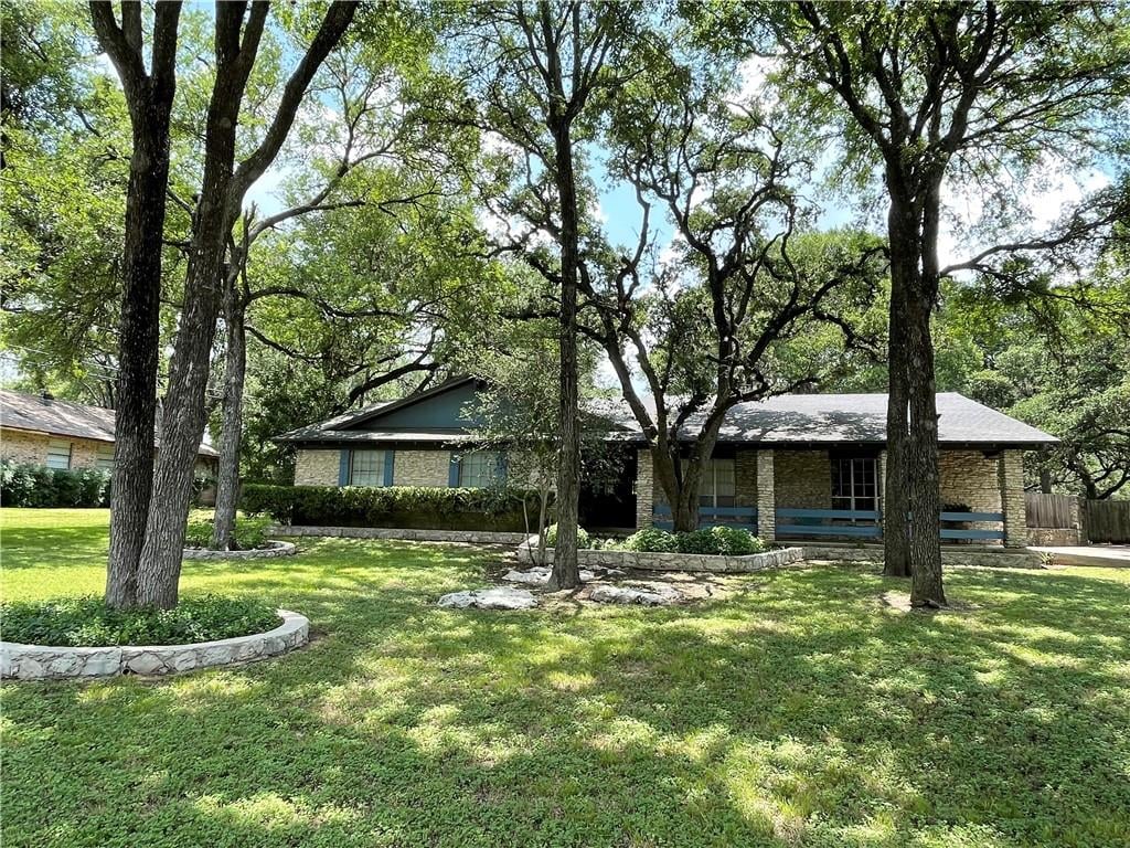 View 10905 Shady Hollow Dr in Shady Hollow Add 10905 Shady Hollow Dr - front exterior - Luxury home in Shady Hollow Add, Austin, TX
