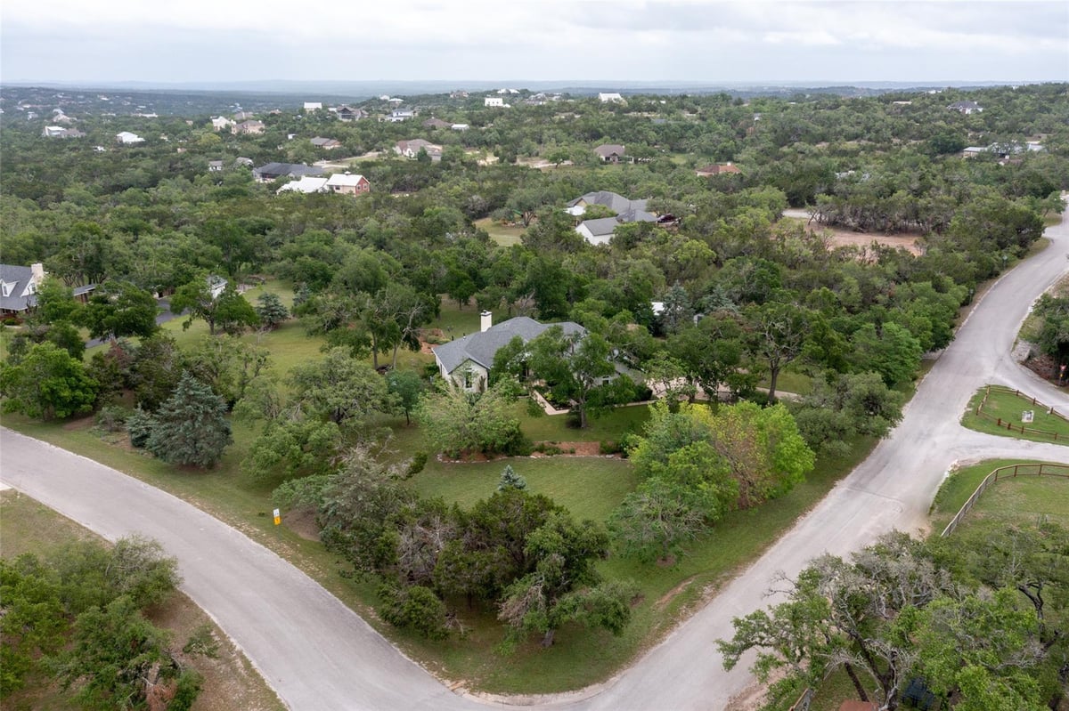 View 10905 W Cave BLVD in West Cave Estate Sec 1 10905 W Cave BLVD - front exterior - Luxury home in West Cave Estate Sec 1, Dripping Springs, TX