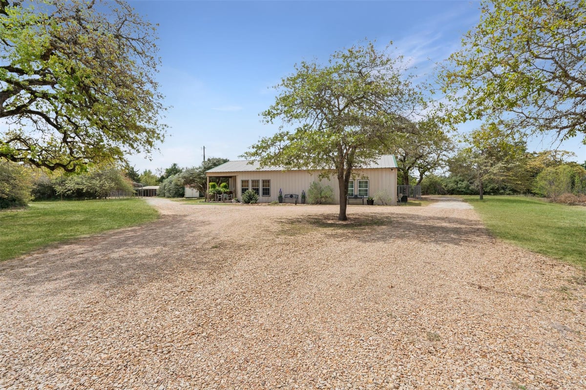 View 10996 Cr 311 in Silver Springs Ranches 10996 Cr 311 - front exterior - Luxury home in Silver Springs Ranches, Rockdale, TX