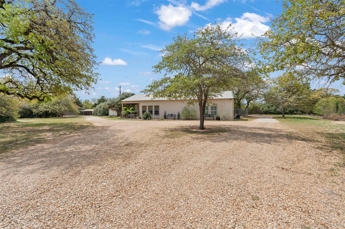 View 10996 Cr 311 in Silver Springs Ranches 10996 Cr 311 - front exterior - Luxury home in Silver Springs Ranches, Rockdale, TX