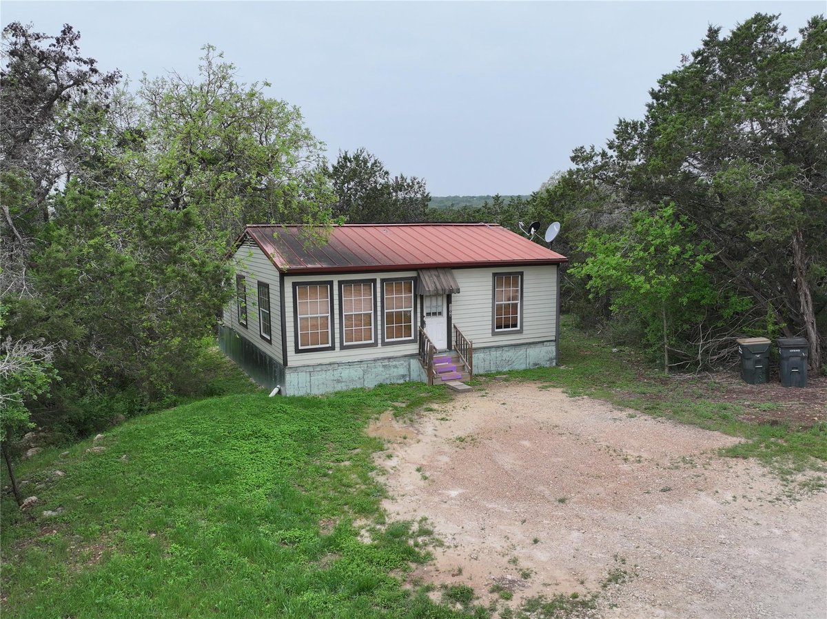 Primary bedroom at 110 Roadrunner Rd Unit #A & B + buildable acreage - Rocky Ranch Acres Sec 2, San Marcos, TX