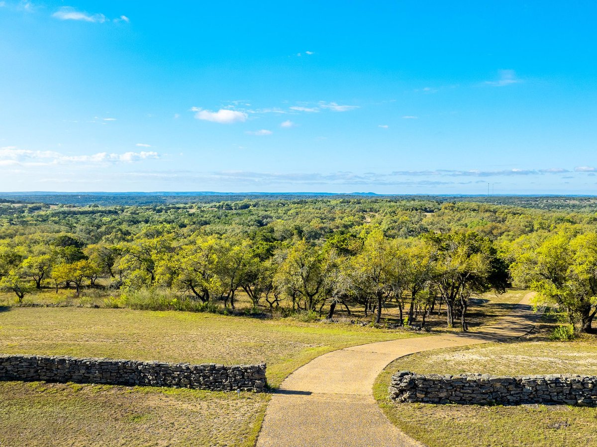 View with oak-studded ranch view at 1100 Pump Station Rd - none, Wimberley, TX