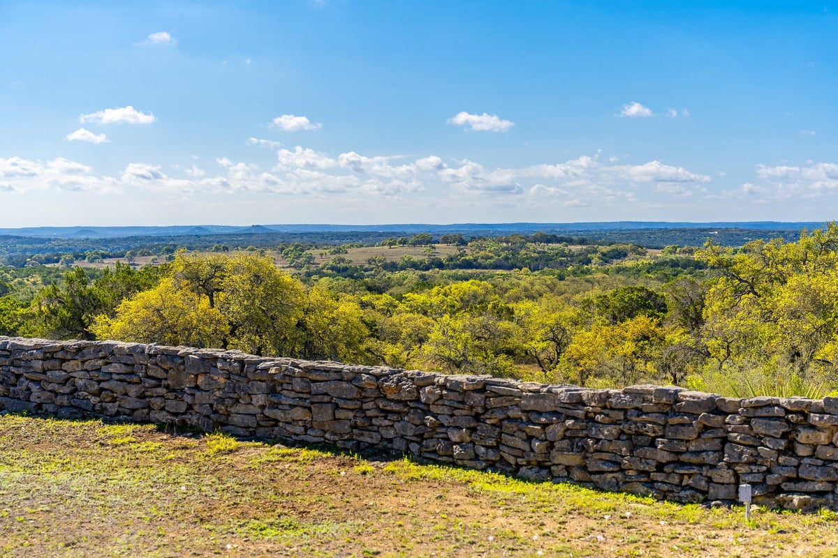 View with dry-stacked stone wall at 1100 Pump Station Rd - none, Wimberley, TX