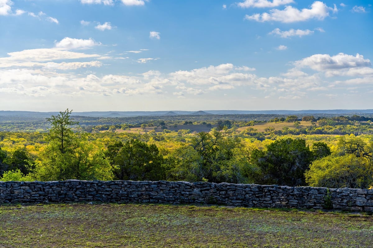 View with long-distance Hill Country view at 1100 Pump Station Rd - none, Wimberley, TX