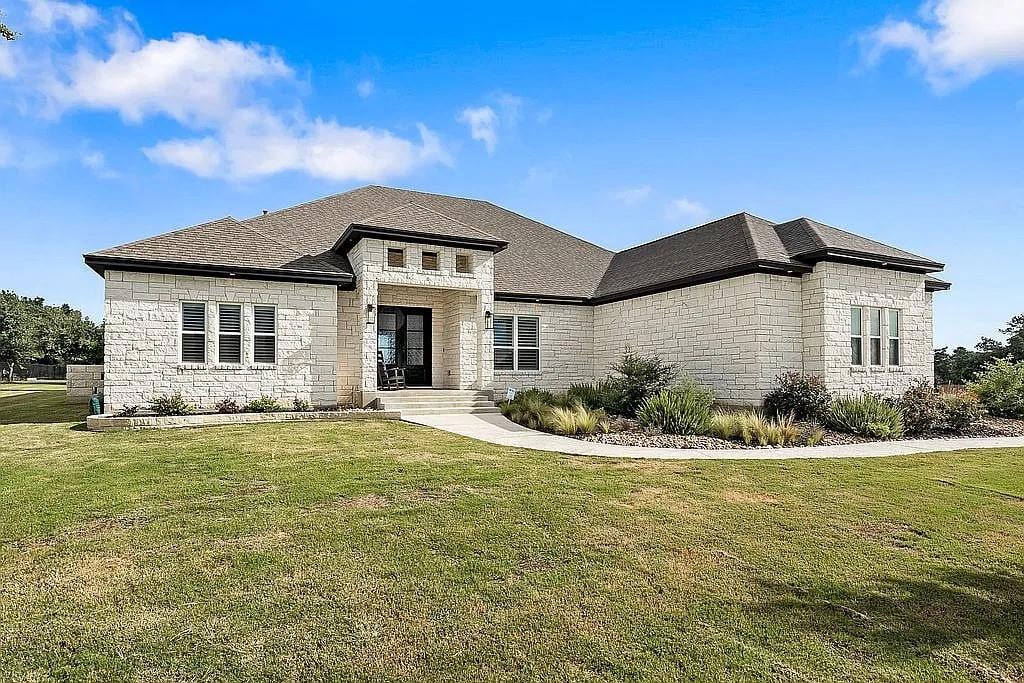 View 1102 Woodpark Ln in Highland Village Ph 1 1102 Woodpark Ln - front exterior - Luxury home in Highland Village Ph 1, Georgetown, TX