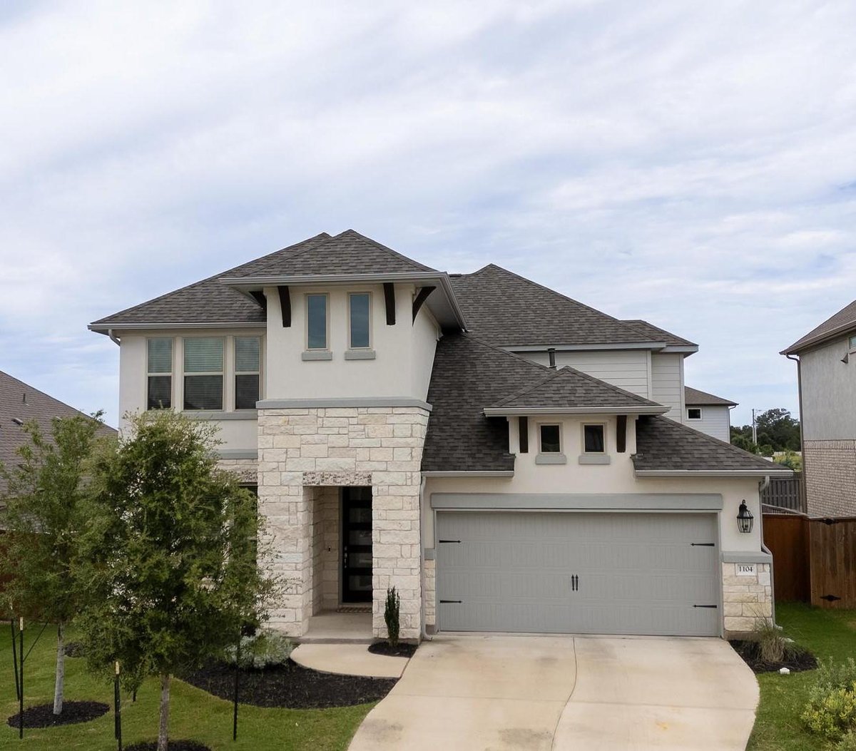 View 1104 Lickety Ln in Parmer Ranch 1104 Lickety Ln - front exterior - Luxury home in Parmer Ranch, Georgetown, TX